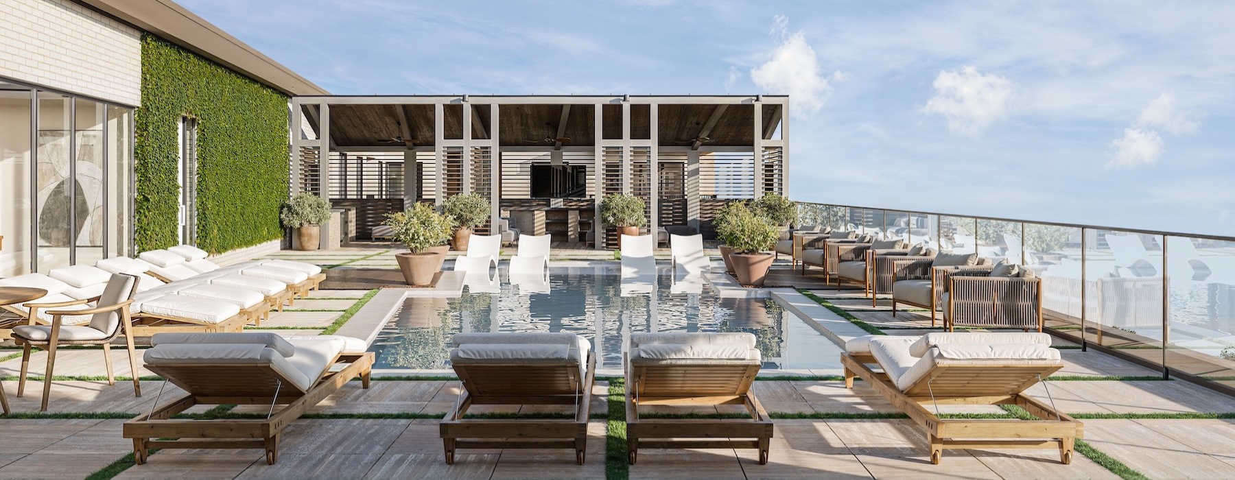 a patio with tables and chairs and a pool in the background
