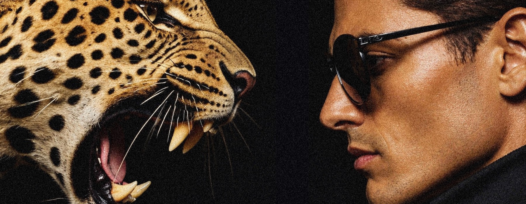 a man with a cheetah